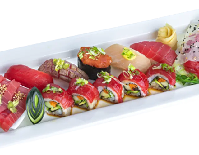 Sushi combination plate with assorted nigiri and specialty rolls