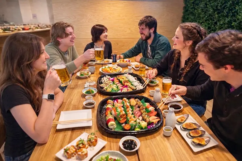 Large sushi platter with assorted rolls and nigiri arranged for sharing